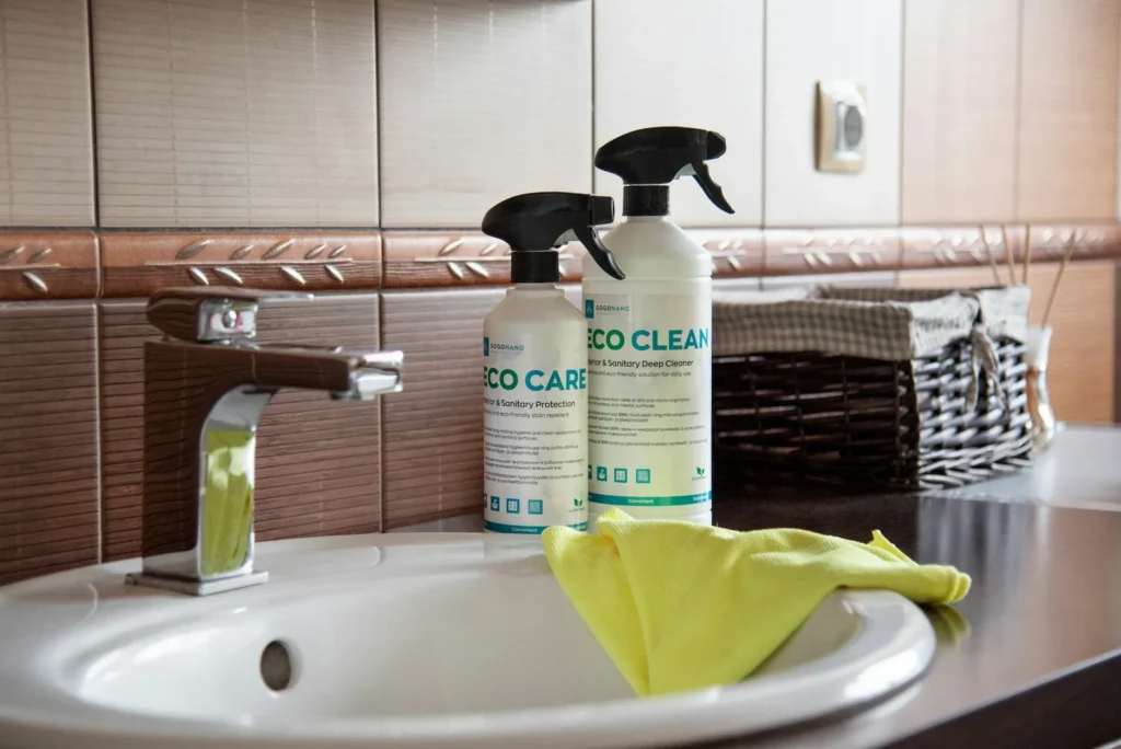 Clean bathroom sink with cleaning products